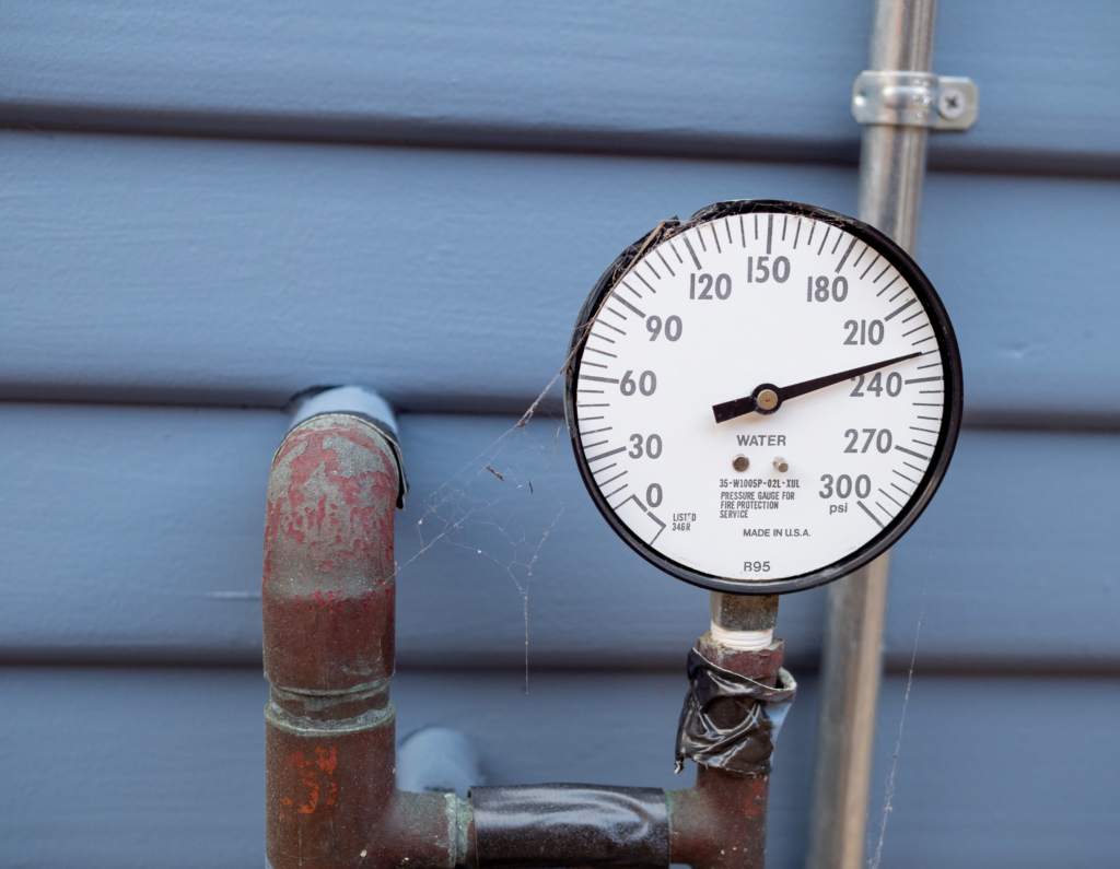 Water pressure testing gauge attached to a residential plumbing system in Rockville Centre, NY.