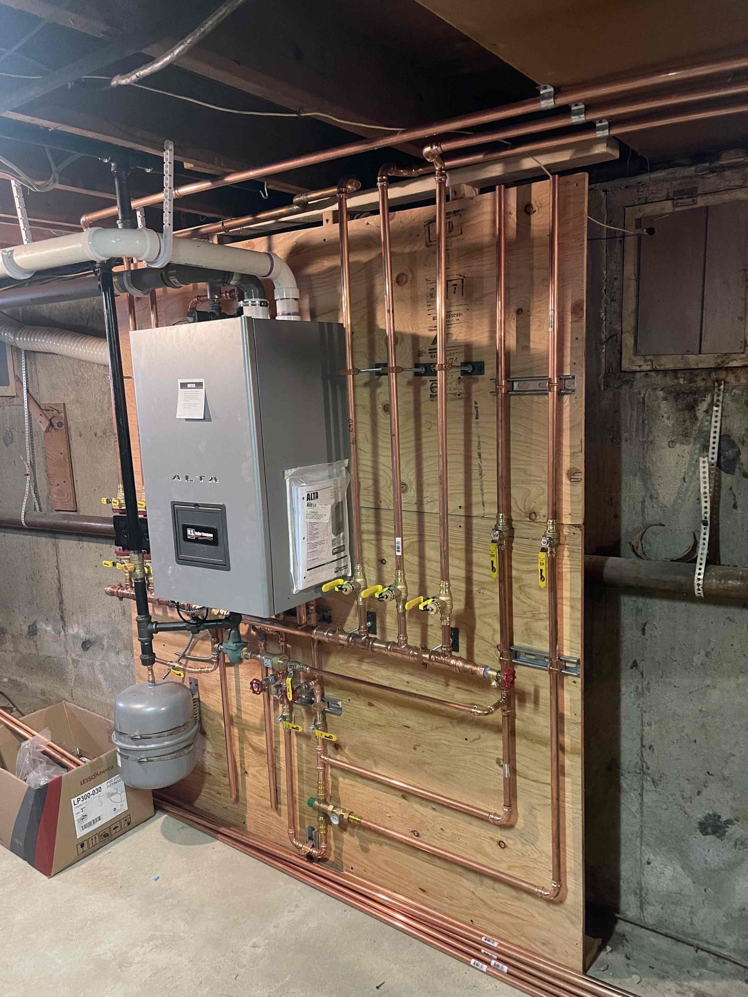 Boiler with expansion tank on the wall in the basement in Rockville Centre, NY