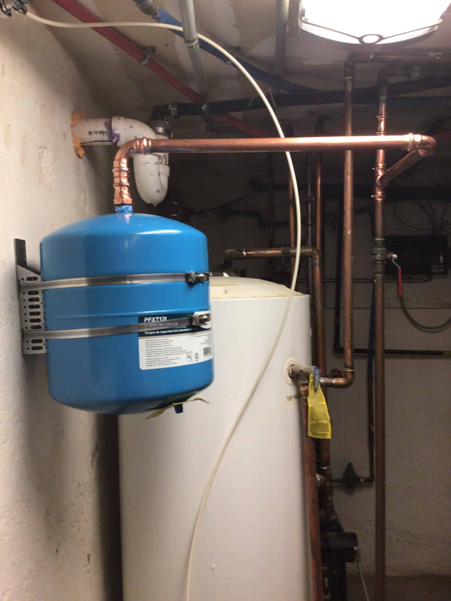 Expansion tank in basement, side view, after Pride Services in Rockville Centre, NY