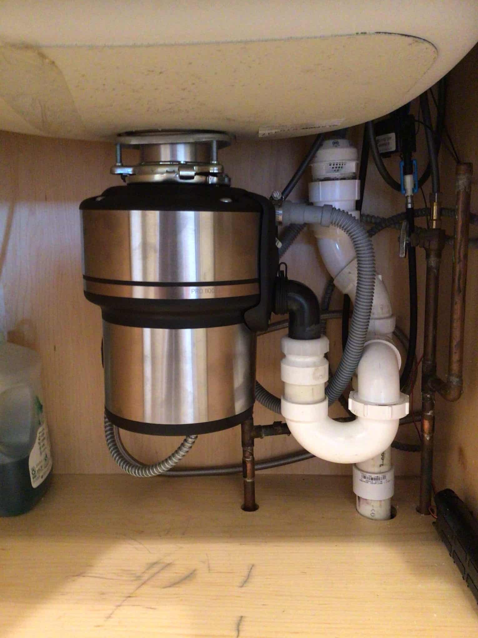 Garbage disposal installation under the sink in Rockville Centre, NY