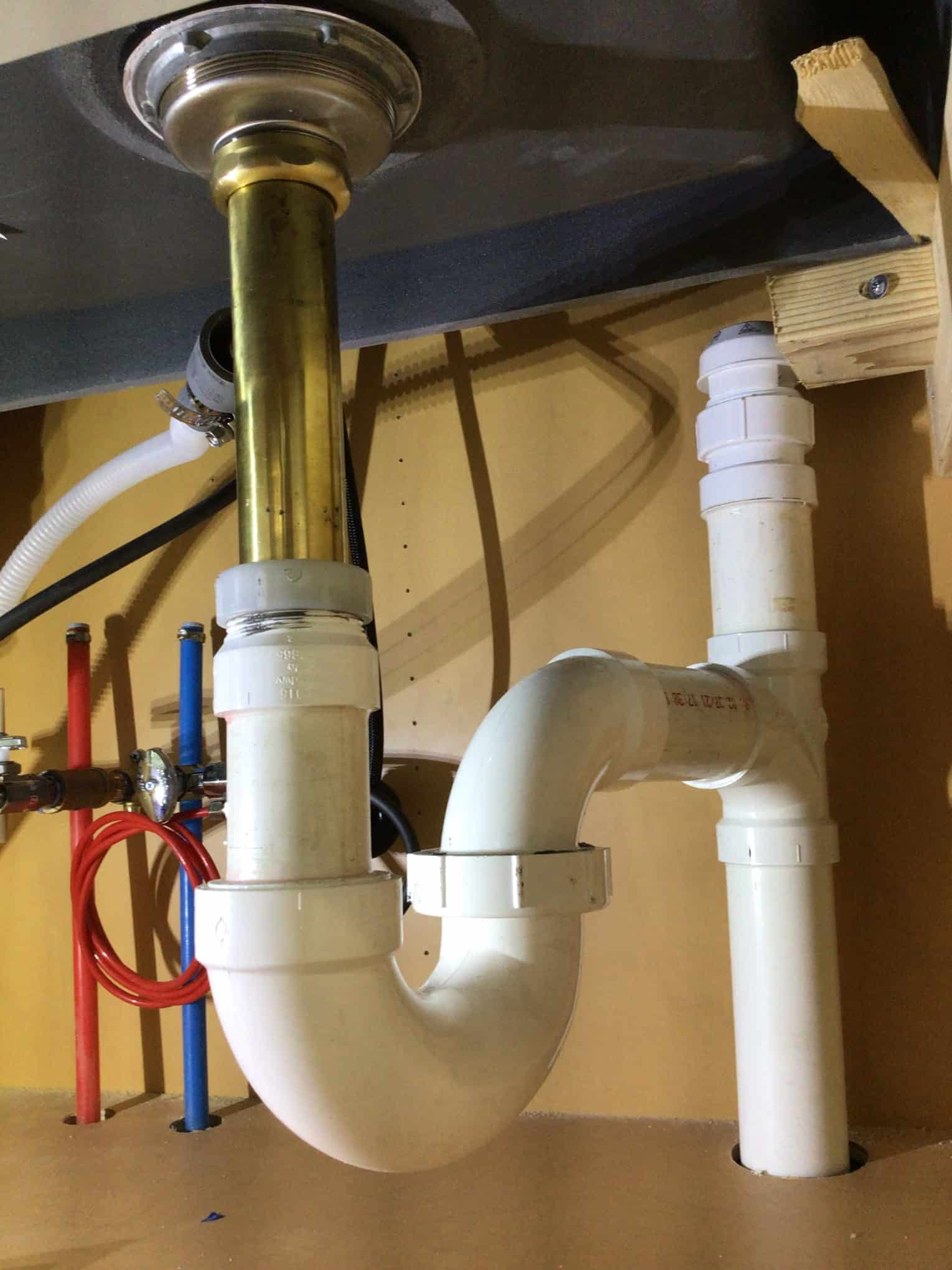 Piping installation below the sink by Pride Services in Rockville Centre, NY