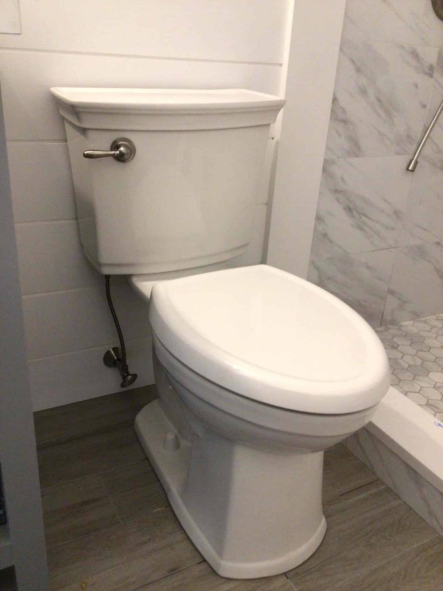 Finished toilet installation in bathroom in Rockville Centre, NY