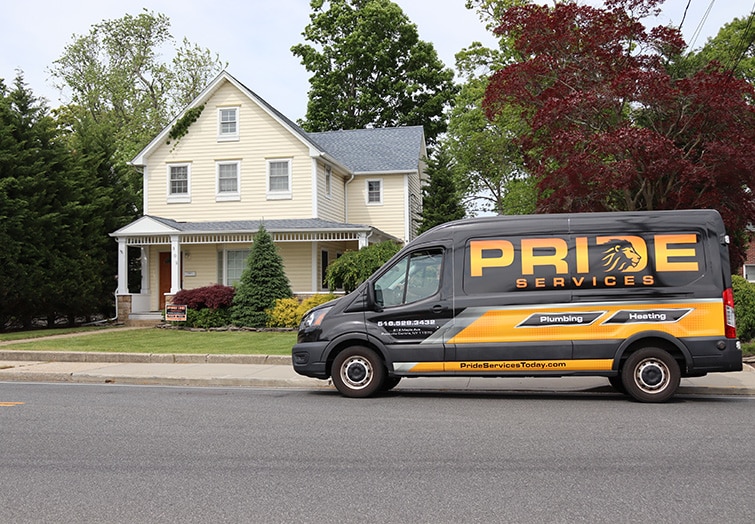 pride services plumbing & hvac van in front of house