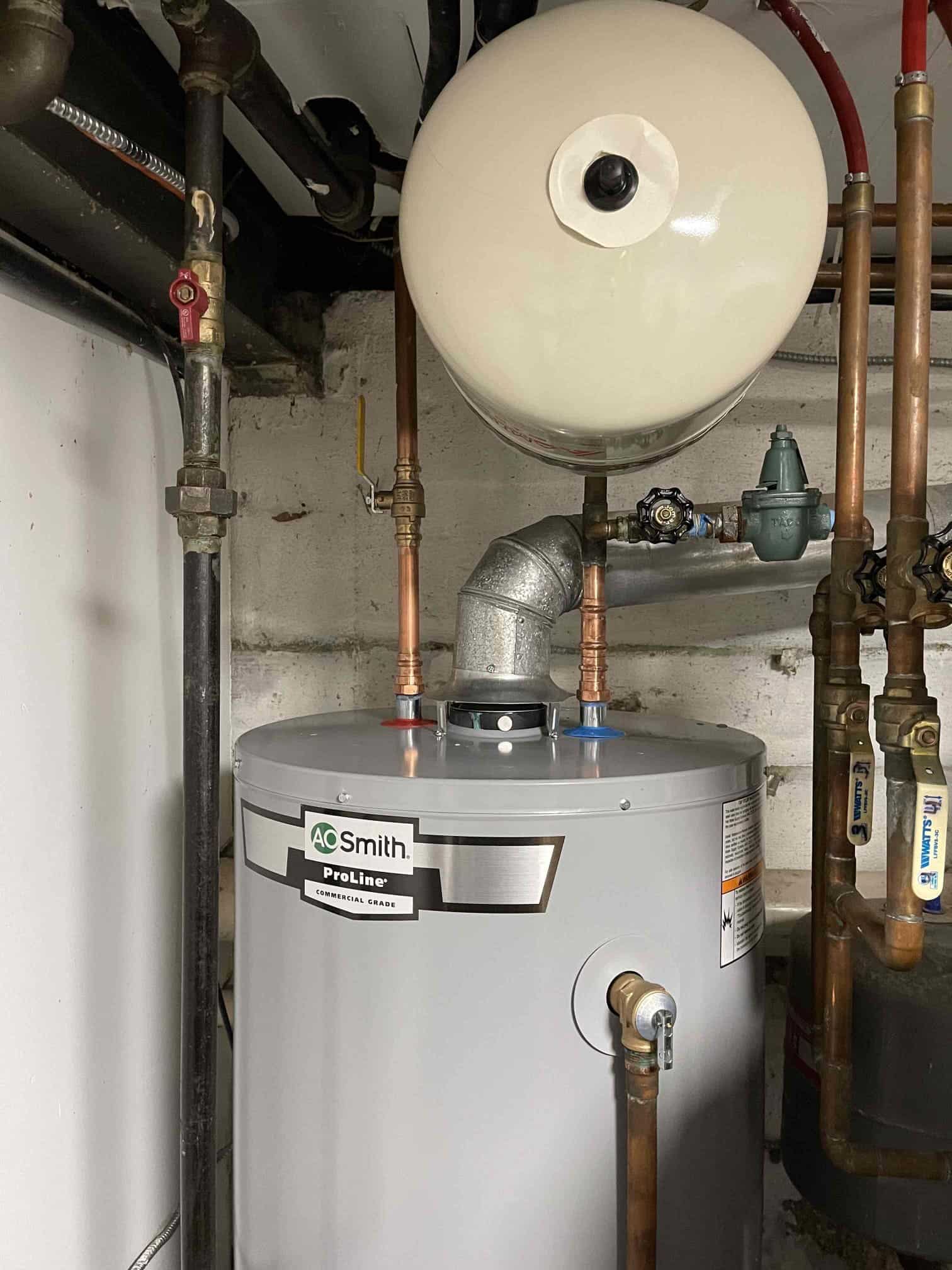 Water heater installed in basement with expansion tank in Rockville Centre, NY