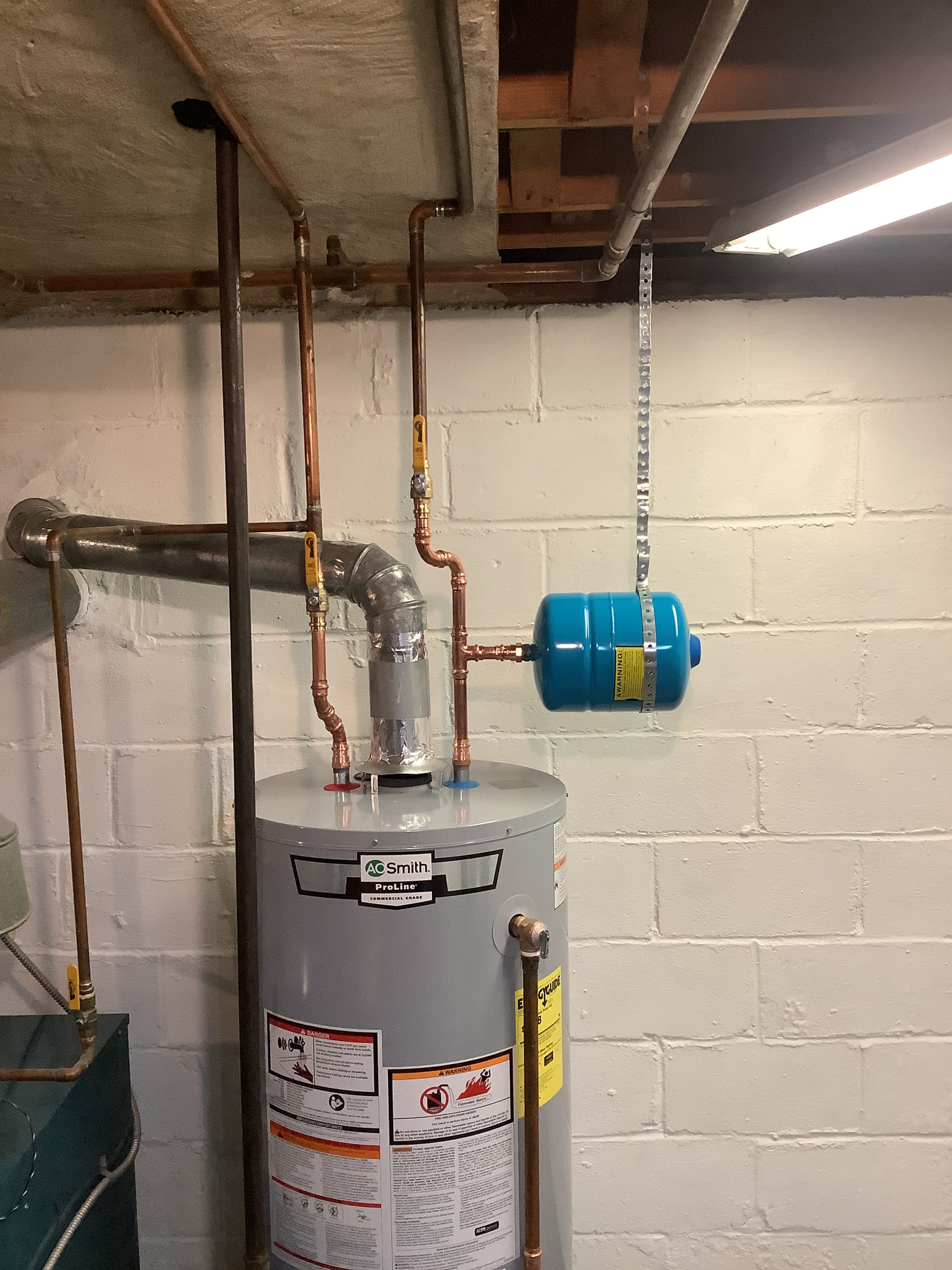 Water heater installed in basement with expansion tank in Rockville Centre, NY